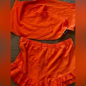 top  /bottom set.The top can be  tied in multiple ways and the short  ruffles .